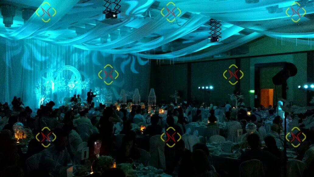 Soundph blue ambient lighting washing a full ballroom during a formal event
